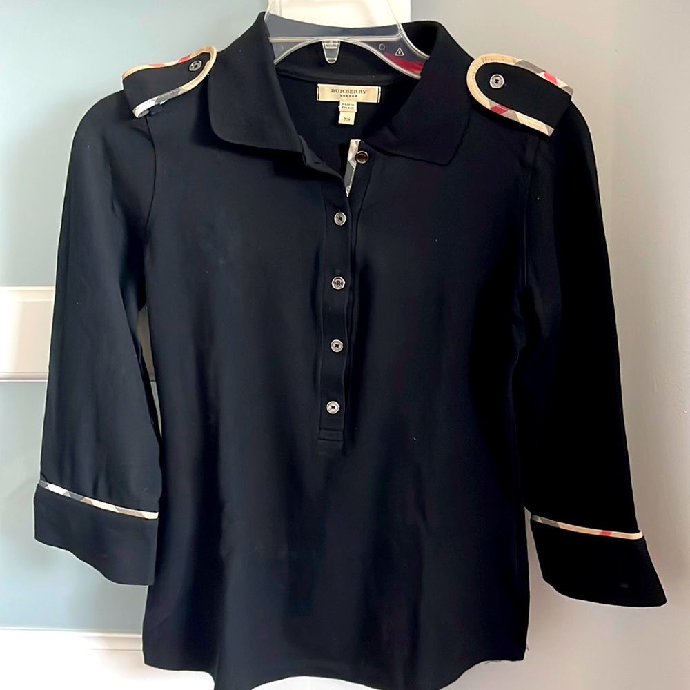 Burberry 3/4 sleeve polo, with vintage print piping and shoulder details.